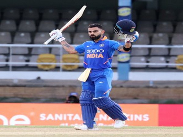 Indian skipper Virat Kohli raises his bat after scoring a century against West Indies in third ODI. (Photo/BCCI Twitter) Indian skipper Virat Kohli raises his bat after scoring a century against West Indies in third ODI. (Photo/BCCI Twitter)