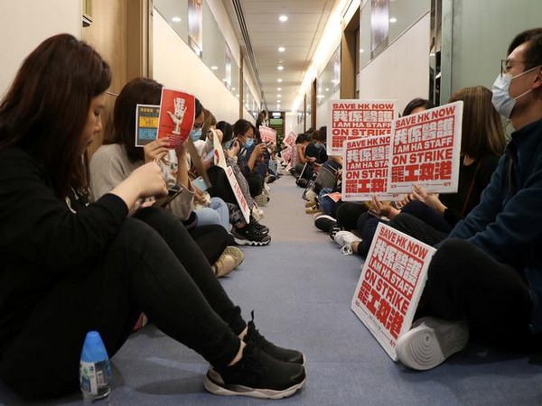 Medical workers wait at a corridor to demand an open dialogue on the novel coronavirus with the senior management, at the Hospital Authority's headquarters in Hong Kong Medical workers wait at a corridor to demand an open dialogue on the novel coronavirus with the senior management, at the Hospital Authority's headquarters in Hong Kong