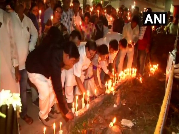 Locals hold candlelight march in protest over Murshidabad triple murder on Saturday. Locals hold candlelight march in protest over Murshidabad triple murder on Saturday.