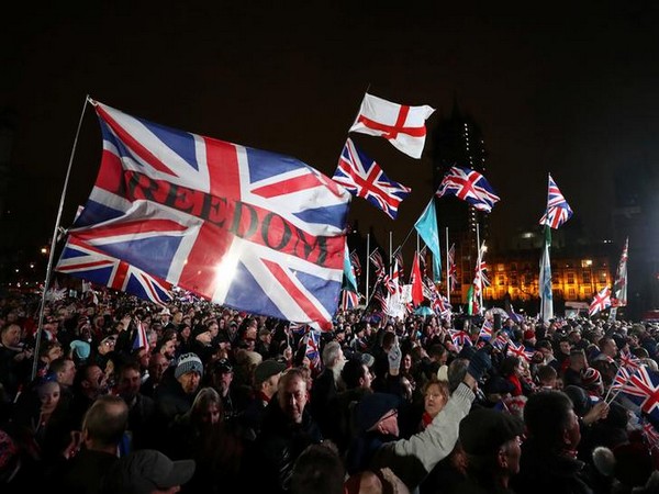 Pro-Brexit demonstrators celebrate on Parliament Square on Brexit day in London.