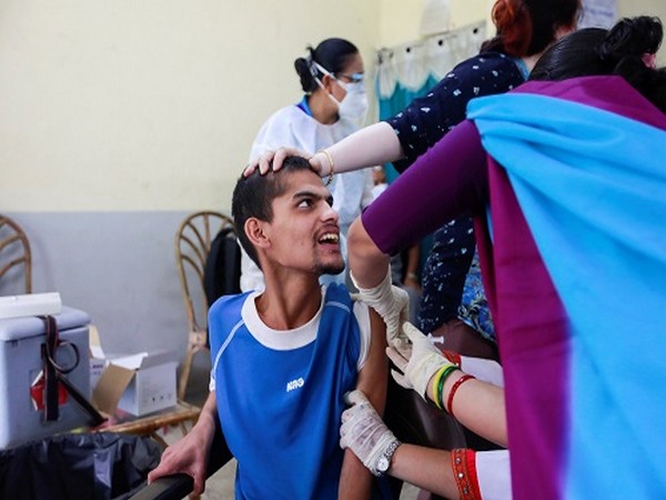 A man receives a dose of Johnson & Johnson COVID-19 vaccine against the coronavirus disease (COVID-19) at Nepal Disabled Association Khagendra New Life Centre in Kathmandu. (Photo Credit: Reuters)