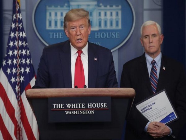 US President Donald Trump addresses the coronavirus task force daily briefing as Vice President Mike Pence stands by at the White House in Washington, US, March 26. US President Donald Trump addresses the coronavirus task force daily briefing as Vice President Mike Pence stands by at the White House in Washington, US, March 26.