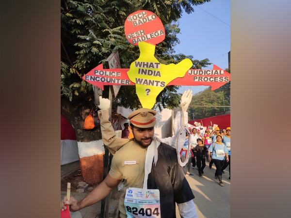 A participants dressed as a police officer and an advocate during the marathon. A participants dressed as a police officer and an advocate during the marathon.