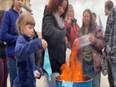 Protesters burn masks to protest against COVID-19 safety guidelines outside Idaho state Capitol in US - Vimarsana News