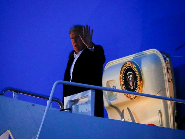 US President Donald Trump waves after returning to Washington DC on Wednesday morning (local time). US President Donald Trump waves after returning to Washington DC on Wednesday morning (local time).