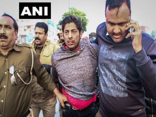 Delhi Police officials with Kapil Gujjar (middle). Delhi Police officials with Kapil Gujjar (middle).