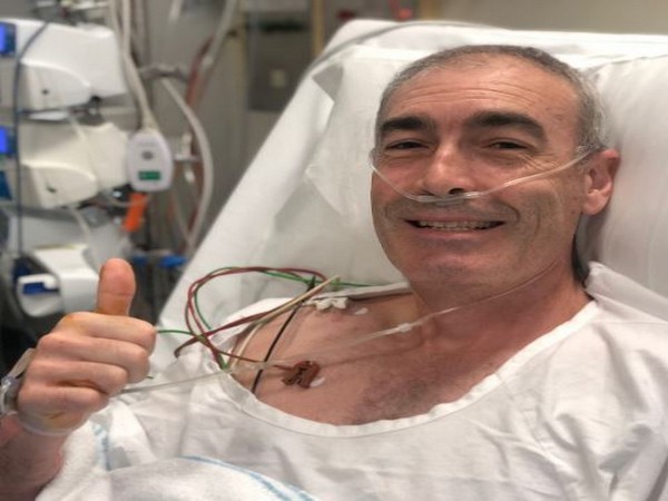 The caption was also accompanied by a picture of Greg on the hospital bed, smiling and giving thumbs up to the camera (Picture Courtesy: Twitter) The caption was also accompanied by a picture of Greg on the hospital bed, smiling and giving thumbs up to the camera (Picture Courtesy: Twitter)