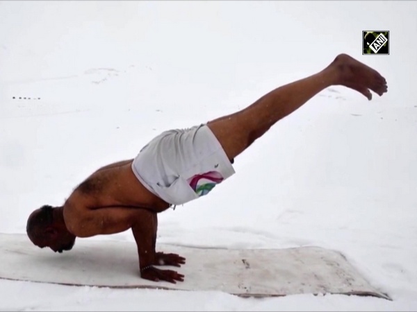 ITBP officer performs Yoga in shorts amid snowfall in Ladakh