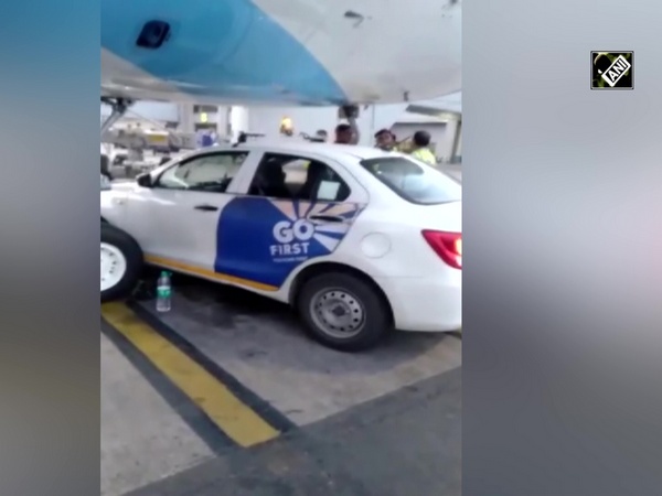 Go Ground Maruti vehicle stopped under nose area of Indigo aircraft at IGI Airport