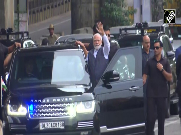 PM Modi greets people on his way to ISRO Mission Control Complex in Bengaluru to meet Scientists